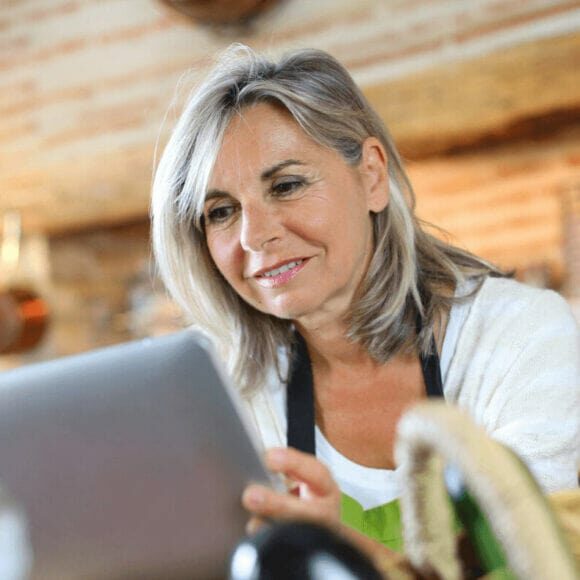 Woman sitting at table with laptop